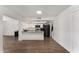 Modern kitchen with white cabinets, stainless steel appliances, and breakfast bar at 3765 W Wood Dr, Phoenix, AZ 85029
