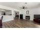 Open-concept living room featuring a fireplace and views into other living areas at 3765 W Wood Dr, Phoenix, AZ 85029