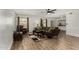 Cozy living room with wood floors, comfortable seating, and a view into the kitchen at 3765 W Wood Dr, Phoenix, AZ 85029