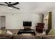 Inviting living room featuring wood floors, accent chair, and lots of natural light at 3765 W Wood Dr, Phoenix, AZ 85029