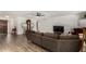 Spacious living room with luxury vinyl plank flooring, neutral walls, and a cozy seating area at 3765 W Wood Dr, Phoenix, AZ 85029