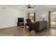 Cozy living room featuring luxury vinyl plank floors, neutral paint, and ample natural light at 3765 W Wood Dr, Phoenix, AZ 85029