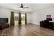 Large living room space with wood floors and sliding doors leading to the backyard at 3765 W Wood Dr, Phoenix, AZ 85029