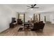 Bright living room with wood floors, plush sofa, and windows overlooking the pool at 3765 W Wood Dr, Phoenix, AZ 85029