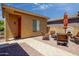 Inviting outdoor courtyard featuring a comfortable seating area and a charming water feature, perfect for relaxation at 42311 W Good Vibrations Ln, Maricopa, AZ 85138