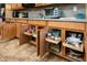Well-organized kitchen cabinets featuring pull-out shelves for easy access and efficient storage solutions at 42311 W Good Vibrations Ln, Maricopa, AZ 85138