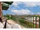 Relaxing balcony featuring stylish patio furniture, scenic city views, and green railings at 424 S 2Nd St # 306, Phoenix, AZ 85004