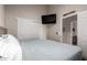 Bedroom features a mounted TV and a closet at 424 S 2Nd St # 306, Phoenix, AZ 85004