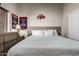 Comfortable bedroom with sports decor and a wooden headboard at 424 S 2Nd St # 306, Phoenix, AZ 85004
