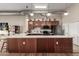 Modern kitchen featuring stainless steel appliances, white countertops, and wood cabinets at 424 S 2Nd St # 306, Phoenix, AZ 85004