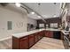 Modern kitchen with dark wood cabinets, spacious countertops, and an open view to the living area at 424 S 2Nd St # 306, Phoenix, AZ 85004