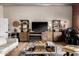 Comfortable living room with wood-look flooring, entertainment center, and contemporary furnishings at 424 S 2Nd St # 306, Phoenix, AZ 85004