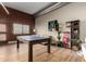 Open-concept living room with a ping pong table and modern decor at 424 S 2Nd St # 306, Phoenix, AZ 85004