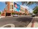 A street view of a building showcasing a soda advertisement and a variety of parking options at 424 S 2Nd St # 306, Phoenix, AZ 85004