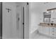 Bathroom with a glass shower, soaking tub, and single sink vanity with granite countertops at 4519 E Amberwood Dr, Phoenix, AZ 85048