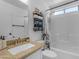 Well-lit bathroom featuring granite countertops, a shower-tub combo, and stylish towel storage at 4519 E Amberwood Dr, Phoenix, AZ 85048