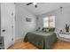 Cozy bedroom with hardwood floors, natural light, and comfortable decor at 4519 E Amberwood Dr, Phoenix, AZ 85048