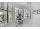 Bright breakfast nook features tile flooring, multiple windows, and built-in display cabinet at 4519 E Amberwood Dr, Phoenix, AZ 85048