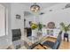 Elegant dining area with glass table, flowers, and arched doorway, offering a welcoming space for dining at 4519 E Amberwood Dr, Phoenix, AZ 85048