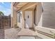 Close-up of the front door with tile entry, adding a touch of elegance to the home's facade at 4519 E Amberwood Dr, Phoenix, AZ 85048