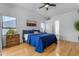 Spacious main bedroom with wood floors, a vaulted ceiling, and ensuite bathroom at 4519 E Amberwood Dr, Phoenix, AZ 85048