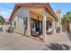 Private patio with tiled flooring, seating area, and well-kept gravel landscaping at 4519 E Amberwood Dr, Phoenix, AZ 85048