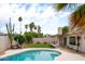 Backyard featuring patio seating, an in-ground pool, and desert landscaping at 4948 E Evans Dr, Scottsdale, AZ 85254