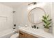Stylish bathroom with modern finishes featuring a single sink, tub, and shower at 4948 E Evans Dr, Scottsdale, AZ 85254