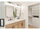 Bright bathroom features double sinks, quartz countertops, and a large walk-in closet at 4948 E Evans Dr, Scottsdale, AZ 85254