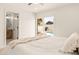 Bright bedroom featuring pool access and a view of the en suite bathroom at 4948 E Evans Dr, Scottsdale, AZ 85254
