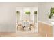 Bright dining area featuring a round table and multiple windows offering natural light at 4948 E Evans Dr, Scottsdale, AZ 85254