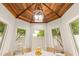 Charming dining room with wood ceiling, skylight, and views of the backyard at 4948 E Evans Dr, Scottsdale, AZ 85254