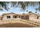 Attractive single-story home with desert landscaping, brick walkway, built-in seating and a two-car garage at 4948 E Evans Dr, Scottsdale, AZ 85254