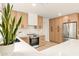 Spacious modern kitchen with quartz countertops, stainless steel appliances, and ample cabinetry at 4948 E Evans Dr, Scottsdale, AZ 85254
