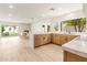 Bright and airy kitchen with a view to the dining and living areas plus access to outdoor space at 4948 E Evans Dr, Scottsdale, AZ 85254