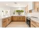 Bright modern kitchen with quartz countertops and view of backyard at 4948 E Evans Dr, Scottsdale, AZ 85254