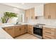 Modern kitchen with quartz countertops and garden view at 4948 E Evans Dr, Scottsdale, AZ 85254