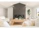 Cozy living room features a sleek fireplace, light wood floors, and comfortable modern seating at 4948 E Evans Dr, Scottsdale, AZ 85254
