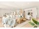 Open-concept living area with hardwood floors, comfortable seating, and seamless flow to other rooms at 4948 E Evans Dr, Scottsdale, AZ 85254