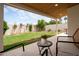 An inviting backyard features a covered patio, lush lawn, and an attractive flower pot at 4948 E Evans Dr, Scottsdale, AZ 85254
