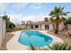 Backyard pool featuring modern design, a surrounding patio, palm tree, and well-maintained landscaping at 4948 E Evans Dr, Scottsdale, AZ 85254