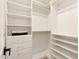 Well-organized walk-in closet with built-in shelving and drawers offers ample storage at 4948 E Evans Dr, Scottsdale, AZ 85254