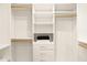 Well-organized walk-in closet with built-in shelving and drawers offers ample storage at 4948 E Evans Dr, Scottsdale, AZ 85254