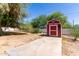 Backyard featuring a shed and desert landscape at 511 E Purdue Ave, Phoenix, AZ 85020
