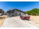 Backyard featuring basketball hoop, outdoor seating area, and desert landscape at 511 E Purdue Ave, Phoenix, AZ 85020