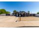 Charming single-story home featuring a covered porch, desert landscaping and a long driveway at 511 E Purdue Ave, Phoenix, AZ 85020