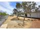 Expansive backyard features desert landscaping, mature trees and a long, single story home at 53404 W Candlelight Rd, Maricopa, AZ 85139