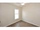 Bright bedroom with light-colored walls, wood-look floors, a ceiling fan, and lots of natural light at 53404 W Candlelight Rd, Maricopa, AZ 85139