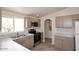 Modern kitchen with stainless steel appliances, sleek cabinets, and marble countertops at 53404 W Candlelight Rd, Maricopa, AZ 85139