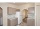 Efficient kitchen with white appliances, ample cabinet space, and modern countertops at 53404 W Candlelight Rd, Maricopa, AZ 85139